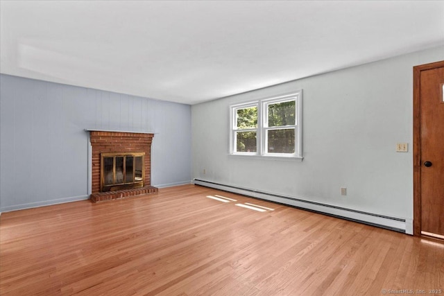 45 Canton Rd, Granby, CT 06035 - unfurnished living room featuring a baseboard radiator, wood finished floors, and a brick fireplace
