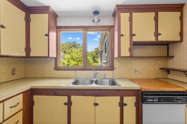 45 Canton Rd, Granby, CT 06035 - kitchen featuring white dishwasher, wallpapered walls, light countertops, and decorative backsplash
