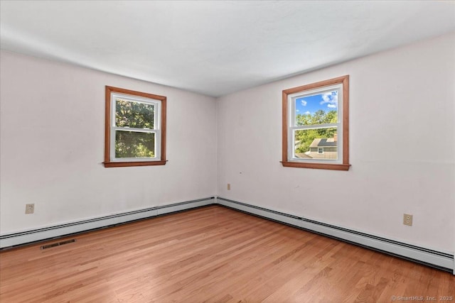 45 Canton Rd, Granby, CT 06035 - empty room featuring wood finished floors and a baseboard heating unit