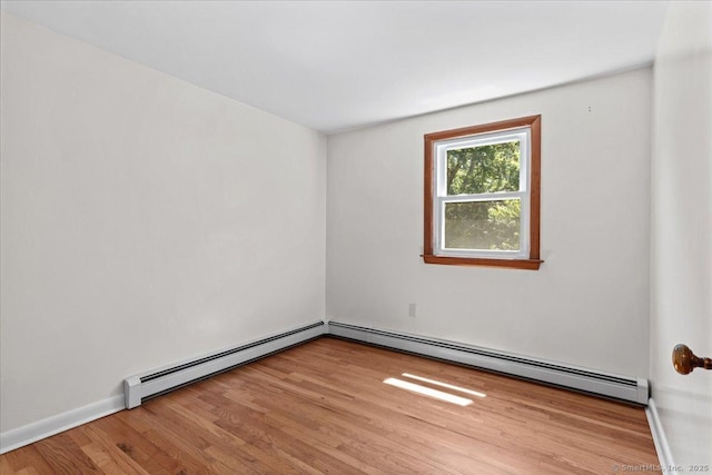 45 Canton Rd, Granby, CT 06035 - unfurnished room featuring a baseboard heating unit and wood finished floors