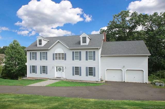 29 Quarry Ln, Hamden, CT 06518 - colonial house with driveway, a chimney, roof with shingles, and a front yard