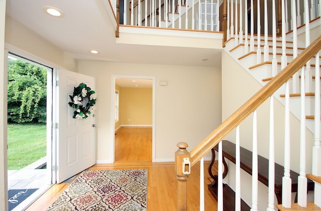 29 Quarry Ln, Hamden, CT 06518 - foyer entrance with light wood finished floors, stairs, and recessed lighting