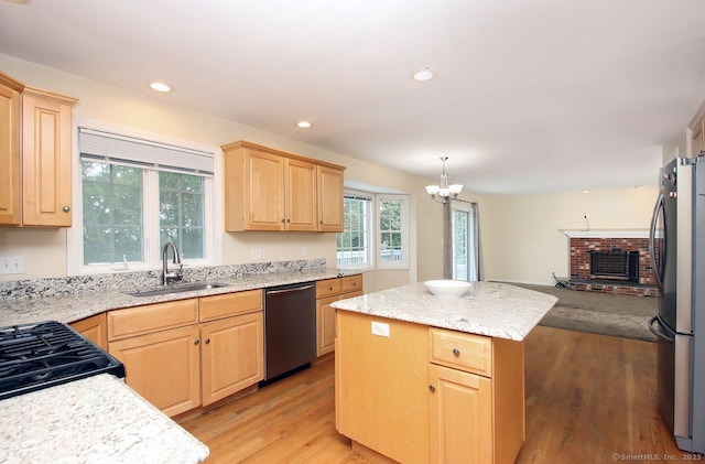 29 Quarry Ln, Hamden, CT 06518 - kitchen featuring appliances with stainless steel finishes, light brown cabinets, light wood-style floors, a kitchen island, and open floor plan