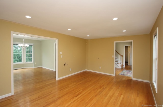 29 Quarry Ln, Hamden, CT 06518 - spare room with light wood-style floors, a chandelier, stairway, and recessed lighting