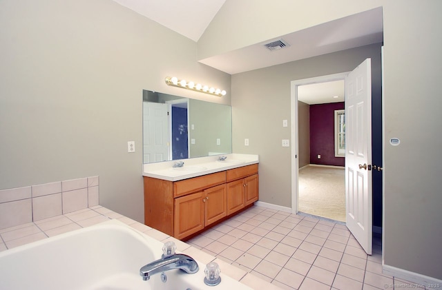 29 Quarry Ln, Hamden, CT 06518 - full bathroom with double vanity, a garden tub, vaulted ceiling, and tile patterned flooring