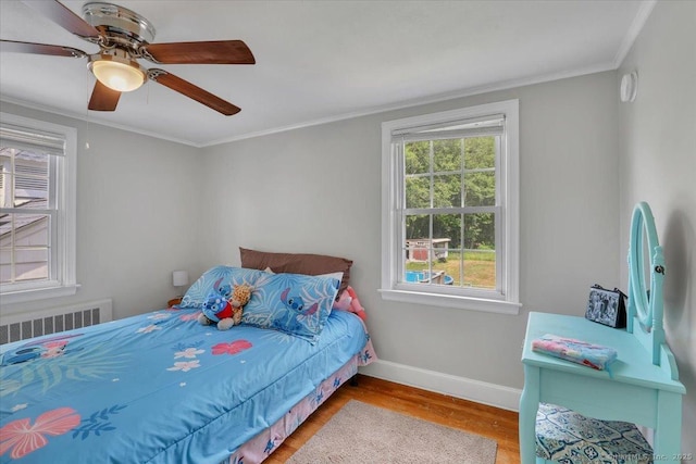 80 Bread And Milk St, Coventry, CT 06238 - bedroom featuring radiator heating unit, wood finished floors, crown molding, and a ceiling fan