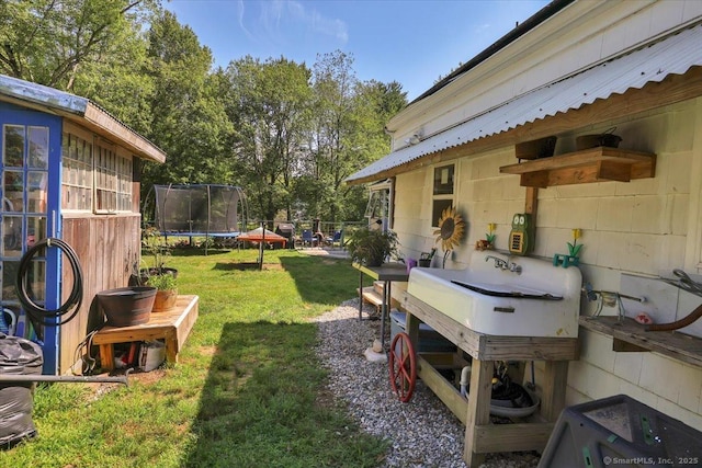 80 Bread And Milk St, Coventry, CT 06238 - view of grassy yard featuring a trampoline and view of scattered trees