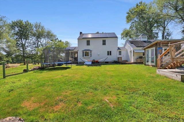 80 Bread And Milk St, Coventry, CT 06238 - back of property with solar panels and a trampoline