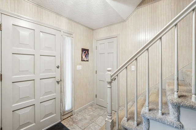 18 Banks Rd, Simsbury, CT 06070 - entrance foyer with stairs, a textured ceiling, and light tile patterned floors