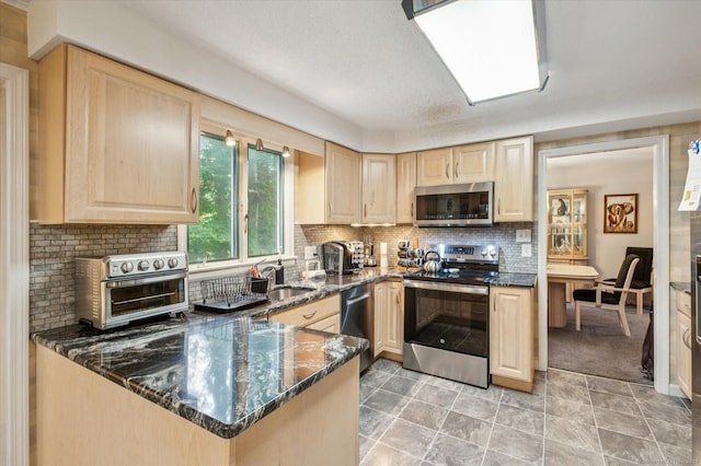 18 Banks Rd, Simsbury, CT 06070 - kitchen with appliances with stainless steel finishes, light brown cabinets, and tasteful backsplash