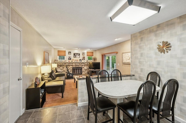 18 Banks Rd, Simsbury, CT 06070 - dining room with a fireplace and dark colored carpet