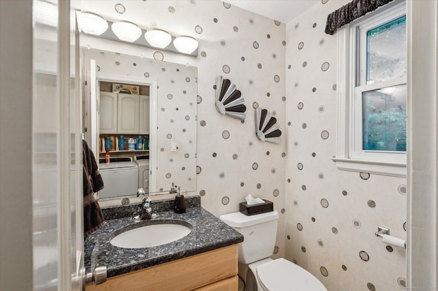 18 Banks Rd, Simsbury, CT 06070 - half bathroom featuring wallpapered walls, washing machine and clothes dryer, and vanity