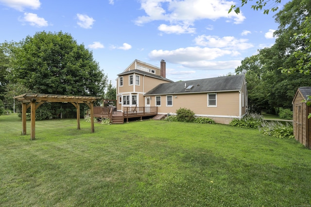 34 Joyce St, Guilford, CT 06437 - back of property with a deck, a yard, a chimney, and a pergola