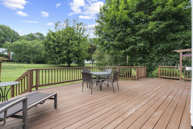 34 Joyce St, Guilford, CT 06437 - wooden terrace with outdoor dining area, a yard, and view of wooded area