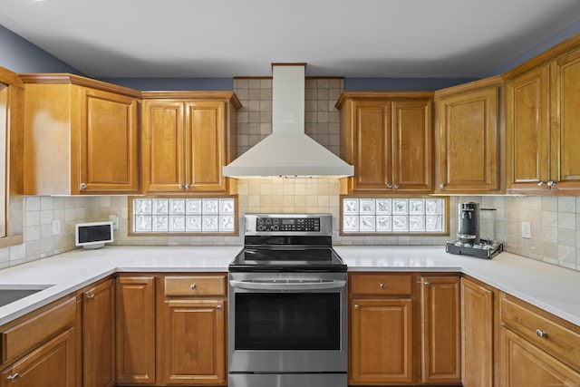 34 Joyce St, Guilford, CT 06437 - kitchen featuring wall chimney range hood, electric range, backsplash, and light countertops
