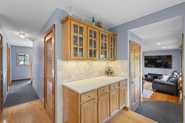 34 Joyce St, Guilford, CT 06437 - bar with light wood finished floors, backsplash, and recessed lighting