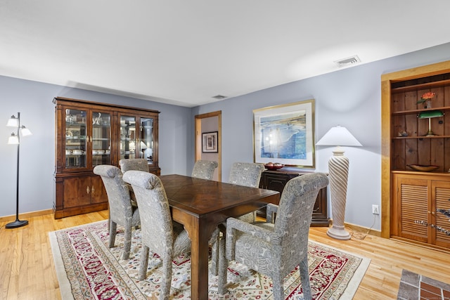 34 Joyce St, Guilford, CT 06437 - dining space with light wood-style floors and baseboards