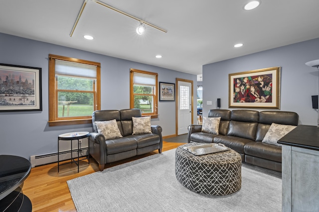 34 Joyce St, Guilford, CT 06437 - living area featuring baseboard heating, recessed lighting, wood finished floors, and track lighting