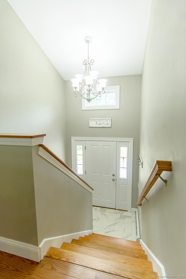40 Airport Rd, Killingly, CT 06239 - entryway featuring a chandelier, light marble finish flooring, stairs, and a high ceiling