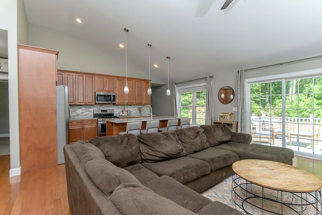 40 Airport Rd, Killingly, CT 06239 - living area with light wood-style flooring, ceiling fan, recessed lighting, and high vaulted ceiling