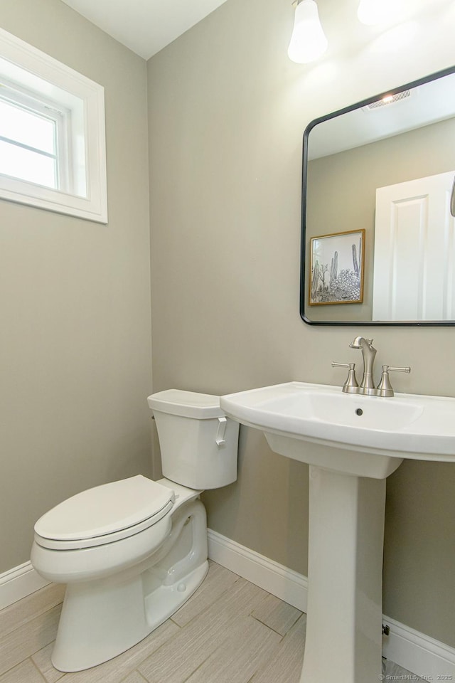 40 Airport Rd, Killingly, CT 06239 - bathroom with toilet and wood finished floors