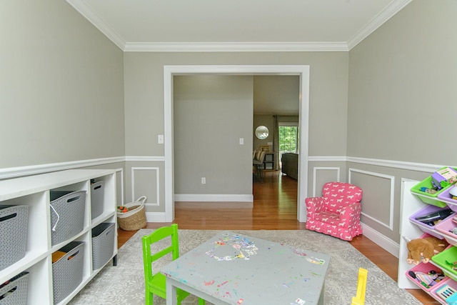 40 Airport Rd, Killingly, CT 06239 - playroom featuring wood finished floors, ornamental molding, and wainscoting
