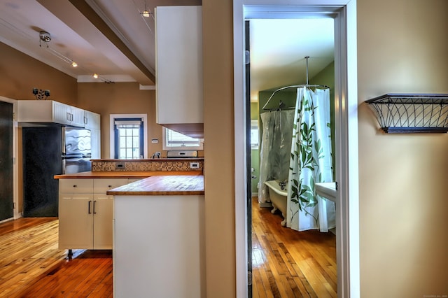 53 Canner St Apt 2, New Haven, CT 06511 - kitchen featuring freestanding refrigerator, light wood-style flooring, white cabinets, butcher block counters, and a peninsula