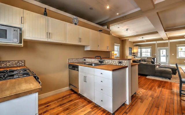 53 Canner St Apt 2, New Haven, CT 06511 - kitchen with stainless steel appliances, butcher block counters, light wood finished floors, a peninsula, and beam ceiling