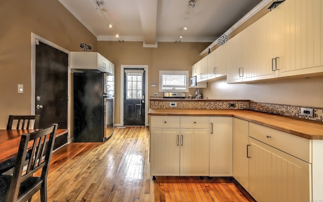 53 Canner St Apt 2, New Haven, CT 06511 - kitchen featuring freestanding refrigerator, wooden counters, stainless steel microwave, light wood-style flooring, and track lighting