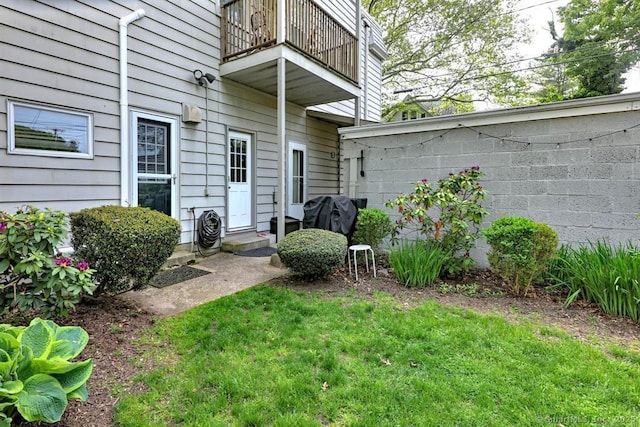 53 Canner St Apt 2, New Haven, CT 06511 - view of exterior entry with a balcony and a yard