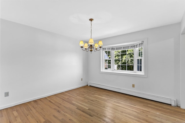 210 Carroll Rd, Fairfield, CT 06824 - spare room featuring baseboard heating, a chandelier, and wood finished floors