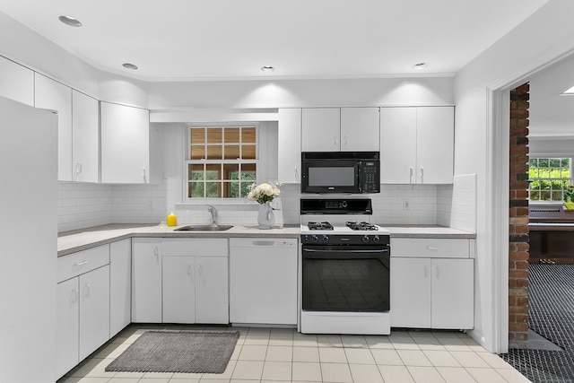 210 Carroll Rd, Fairfield, CT 06824 - kitchen featuring white appliances, light countertops, white cabinets, decorative backsplash, and ornamental molding