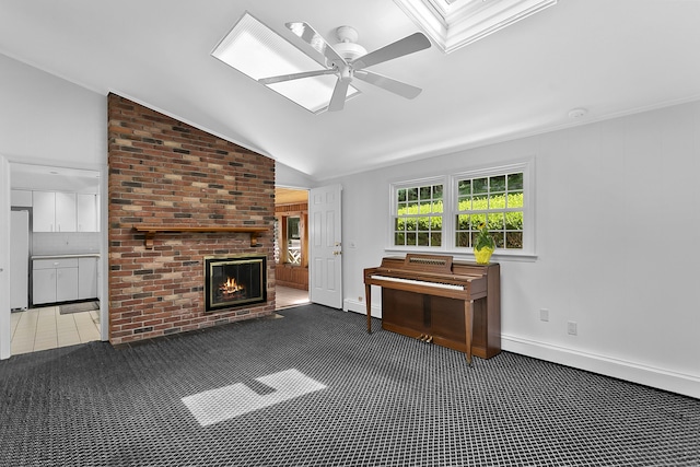 210 Carroll Rd, Fairfield, CT 06824 - living room with lofted ceiling, a fireplace, ceiling fan, carpet flooring, and a skylight