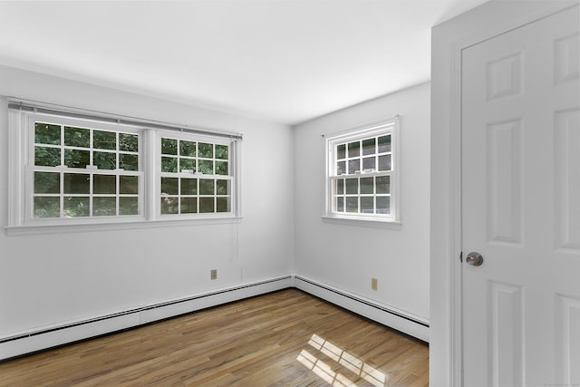 210 Carroll Rd, Fairfield, CT 06824 - empty room with wood finished floors and baseboard heating
