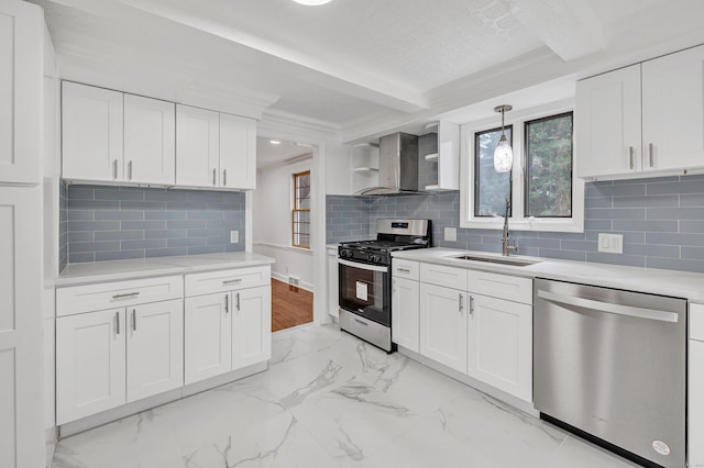 162 Sheppard St, Stratford, CT 06614 - kitchen with appliances with stainless steel finishes, wall chimney range hood, light countertops, white cabinets, and light marble finish floors