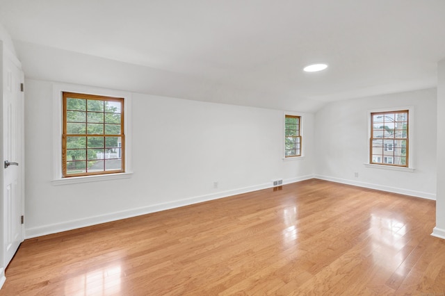 162 Sheppard St, Stratford, CT 06614 - empty room featuring healthy amount of natural light, light wood-type flooring, and lofted ceiling