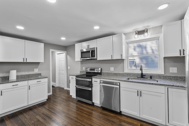 36 Greenfield St, Windsor, CT 06095 - kitchen featuring stainless steel appliances, white cabinetry, light stone counters, and recessed lighting