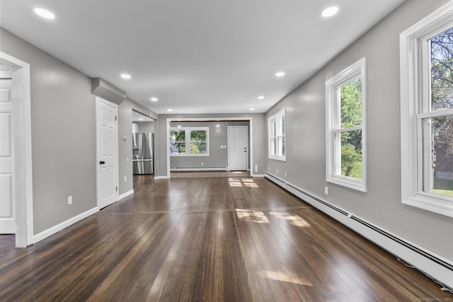 36 Greenfield St, Windsor, CT 06095 - unfurnished living room with a baseboard radiator, dark wood-type flooring, and recessed lighting