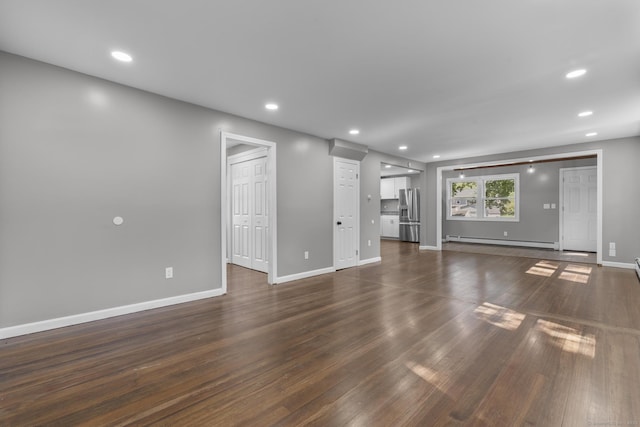 36 Greenfield St, Windsor, CT 06095 - unfurnished living room with baseboard heating, dark wood finished floors, and recessed lighting