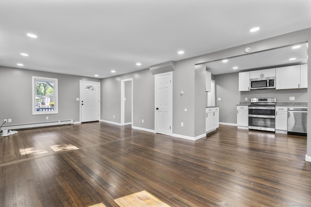 36 Greenfield St, Windsor, CT 06095 - unfurnished living room featuring baseboard heating, recessed lighting, and dark wood-style floors