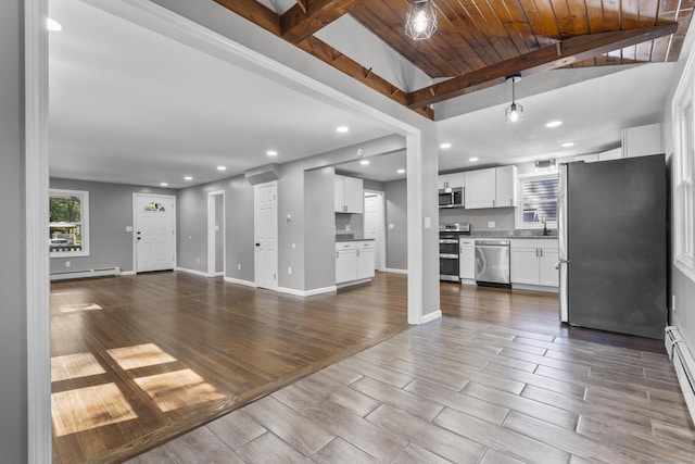 36 Greenfield St, Windsor, CT 06095 - unfurnished living room featuring a baseboard heating unit, dark wood finished floors, recessed lighting, and a wood ceiling with exposed beams