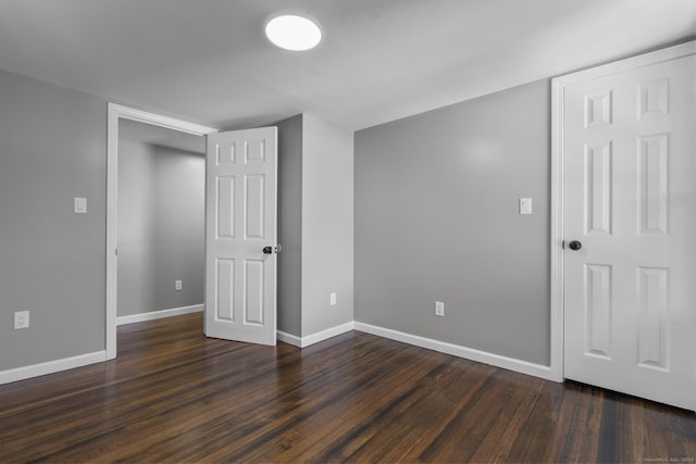 36 Greenfield St, Windsor, CT 06095 - unfurnished bedroom featuring dark wood-type flooring and baseboards