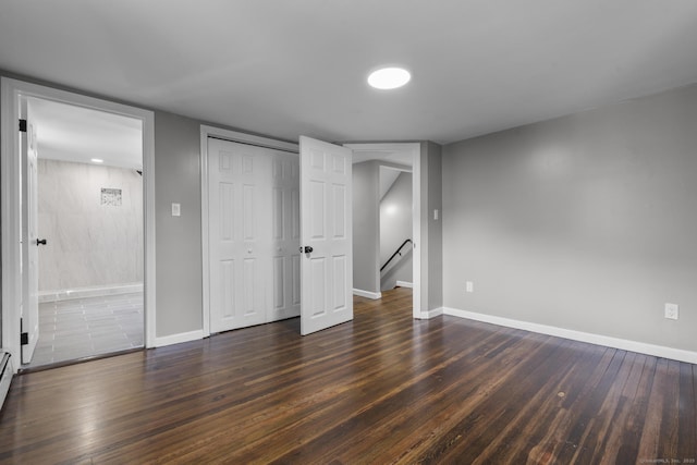 36 Greenfield St, Windsor, CT 06095 - unfurnished bedroom with dark wood-type flooring and a baseboard heating unit