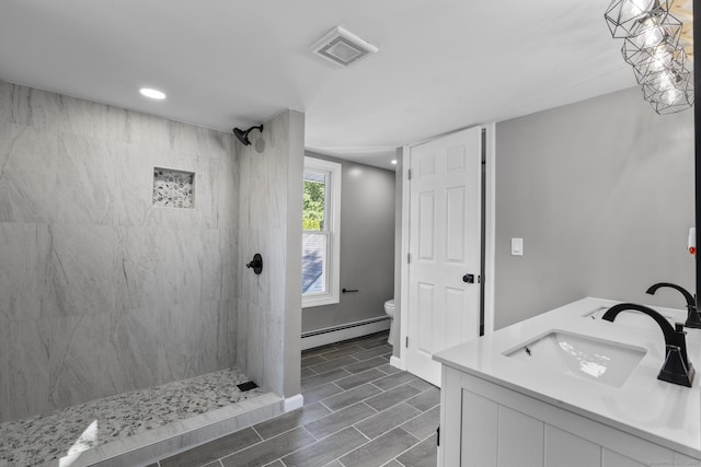 36 Greenfield St, Windsor, CT 06095 - full bathroom featuring a baseboard heating unit, tiled shower, double vanity, and recessed lighting