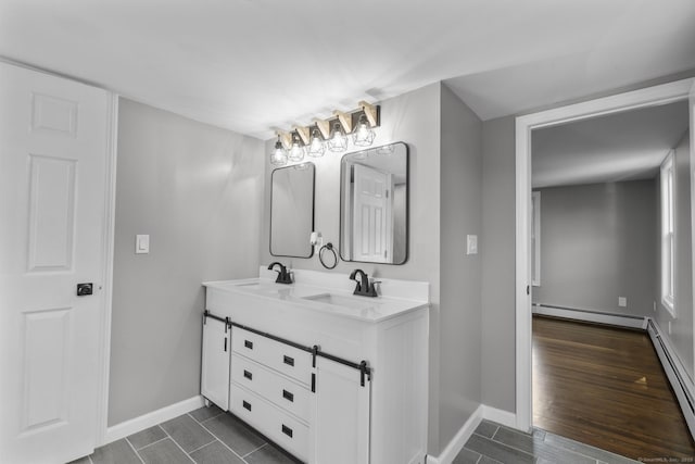 36 Greenfield St, Windsor, CT 06095 - bathroom featuring double vanity and baseboard heating
