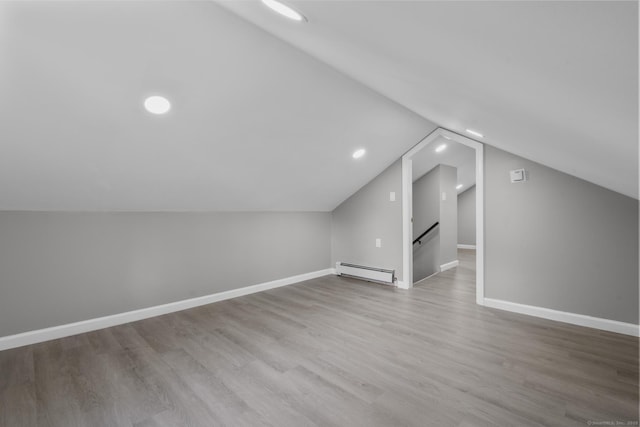 36 Greenfield St, Windsor, CT 06095 - bonus room with baseboard heating, vaulted ceiling, wood finished floors, and recessed lighting