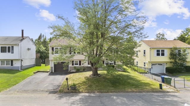 83 Julia Ter, Middletown, CT 06457 - view of front of home featuring an attached garage, driveway, and a front lawn