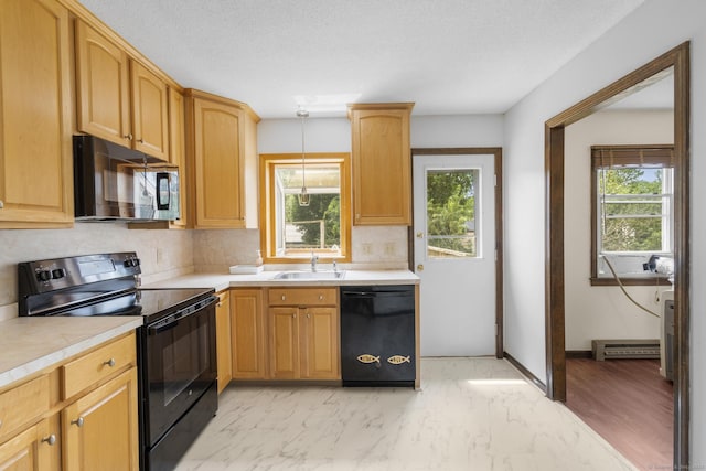 83 Julia Ter, Middletown, CT 06457 - kitchen with black appliances, light countertops, backsplash, and baseboard heating