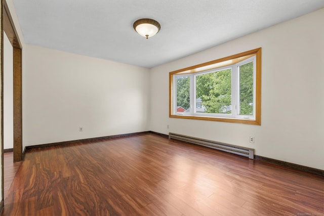 83 Julia Ter, Middletown, CT 06457 - unfurnished room featuring baseboard heating and dark wood-style flooring