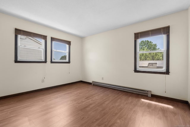 83 Julia Ter, Middletown, CT 06457 - spare room featuring a baseboard radiator and wood finished floors